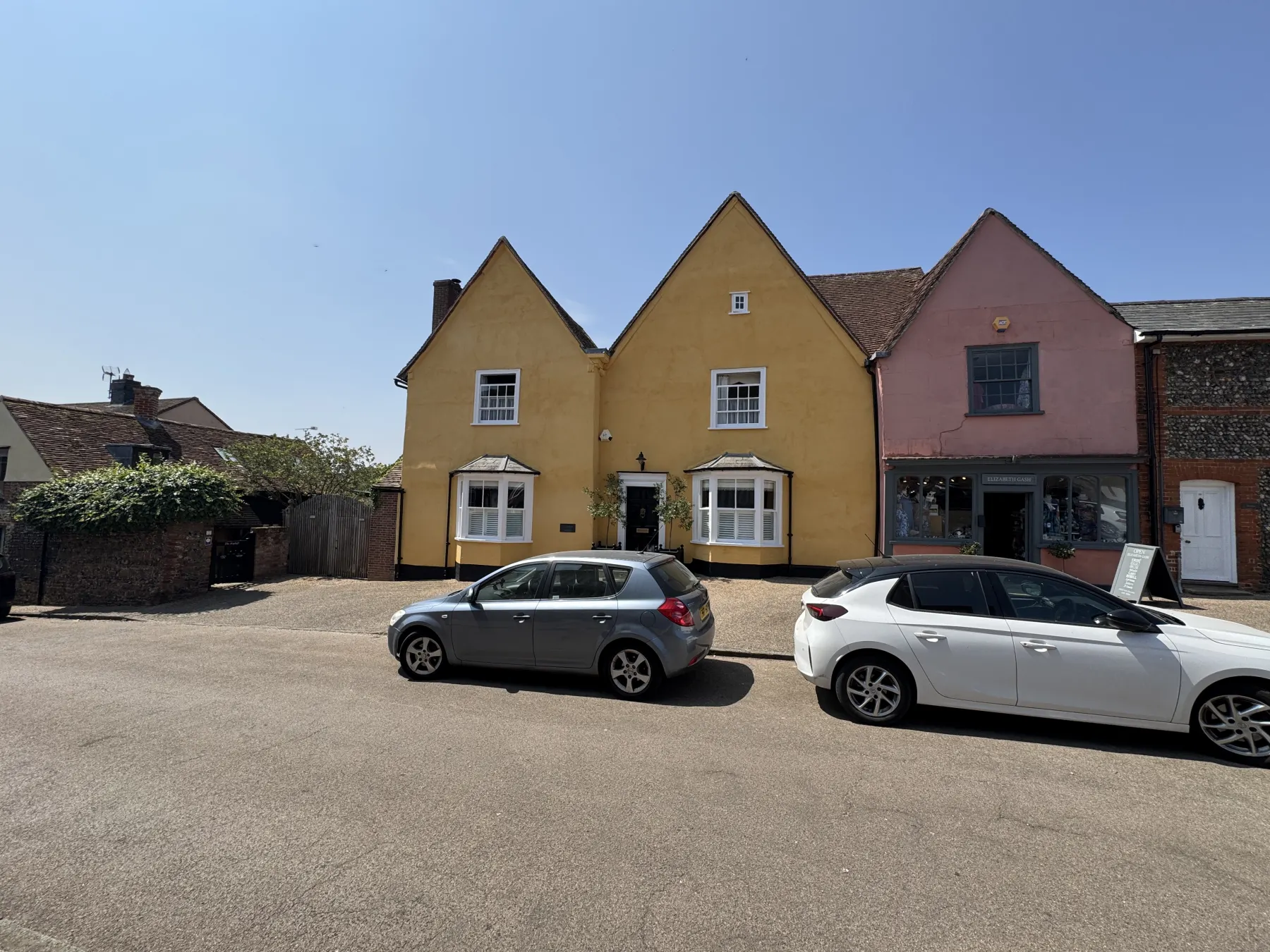 Wide street view of Lavenham period exterior and neighbouring traditional buildings