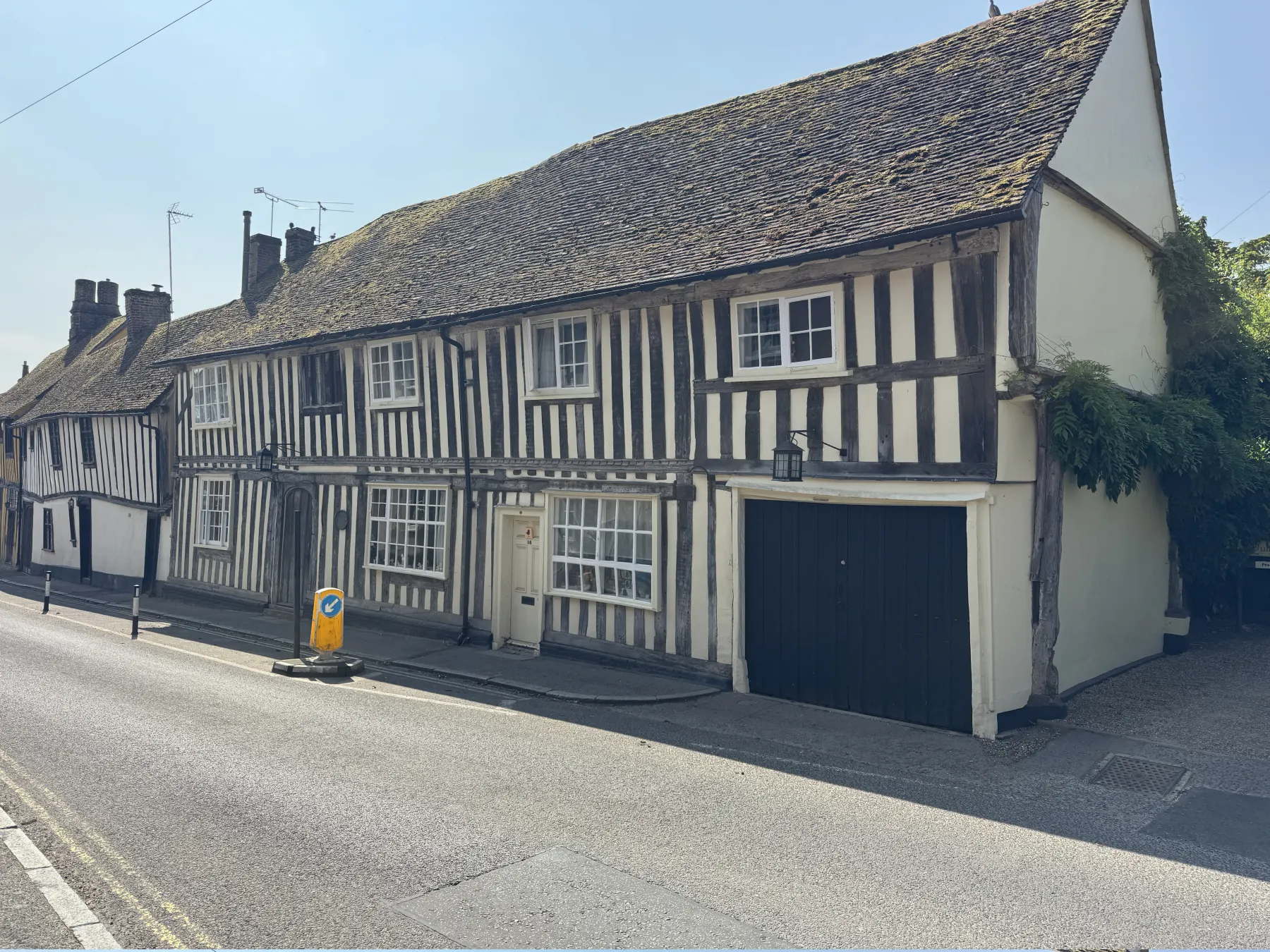 Wide view of a timber-framed period property exterior on a Suffolk street
